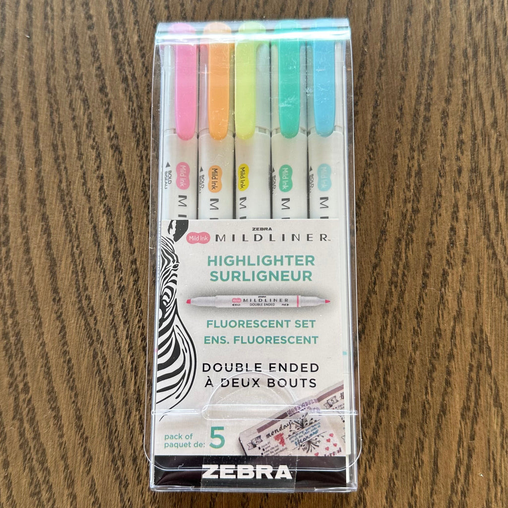 Pack of Zebra highlighters on a wooden surface