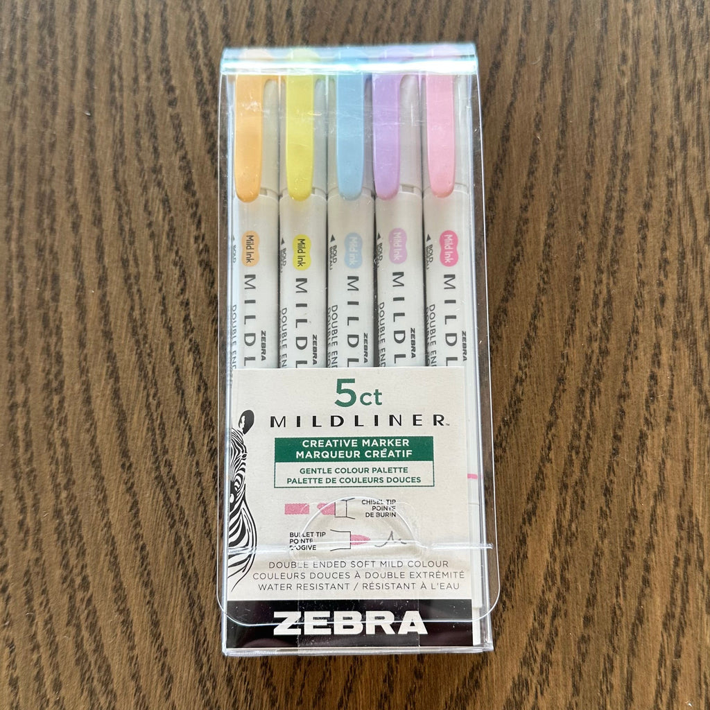 Pack of Zebra highlighters on a wooden surface
