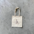 Tote bag with flower print and girl on a bicycle