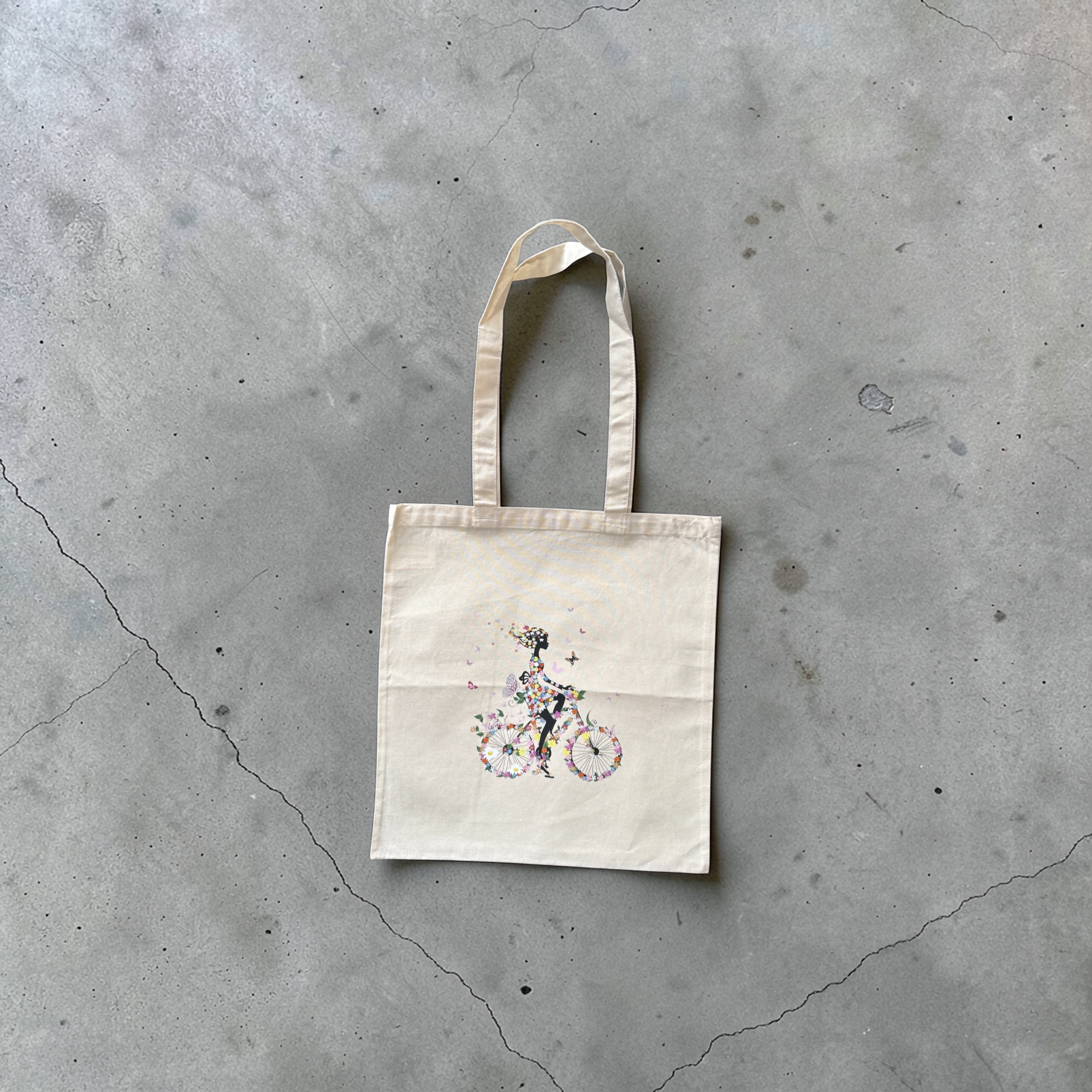 Tote bag with flower print and girl on a bicycle